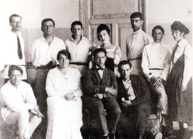 UNOVIS group. Vitebsk. 1922. Left-to-right, standing: I.Chervinko, K.Malevich, T.Royak, A.Kagan N.Suetin, L.Yudin, E.Magaril; seated: M.Vexler, V.Ermolaeva, I.Chashnik, L.Khidekel.