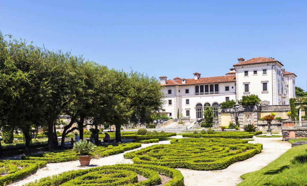 A serene oasis awaits in the heart of bustling Miami - Vizcaya Museum & Gardens. This sprawling estate, once the winter home of industrialist James Deering, is a testament to Gilded Age grandeur and European elegance, offering visitors a captivating glimpse into the past. A Journey Back in Time: Built in the early 20th century, Vizcaya is a Mediterranean Revival architecture masterpiece blending Italian Renaissance and Baroque influences. As you wander through the meticulously manicured gardens and lavishly decorated rooms, you'll be transported to a bygone era of luxury and refinement. Highlights of Vizcaya: The Main House: Explore the 34 rooms of the main house, each adorned with antique furnishings, tapestries, and artwork collected from around the world. The Gardens: Stroll through ten acres of formal gardens featuring fountains, sculptures, and breathtaking views of Biscayne Bay. The Village: Discover the working village, which once supported the estate. It includes a kitchen garden, a blacksmith shop, and staff quarters. Special Events: Vizcaya hosts various events throughout the year, including concerts, lectures, and workshops. Check its website for the latest schedule. New & Noteworthy: Conservation Efforts: Vizcaya is committed to preserving its historic architecture and collections. Recent projects include the restoration of the Tea House and the installation of a new irrigation system in the gardens. Community Engagement: Vizcaya offers educational programs, tours for all ages, and community events that celebrate Miami's diverse culture. Sustainability Initiatives: The museum is actively working to reduce its environmental impact through sustainable practices, such as composting and rainwater harvesting. Visitor Information: Location: 3251 South Miami Avenue, Miami, FL 33129 Hours: Open daily except Tuesdays, 9:30 am - 4:30 pm Admission: Varies depending on age and membership status. Check the website for current rates. Accessibility: Vizcaya is wheelchair accessible, and guided tours for visitors with disabilities are available. Beyond the Walls: Vizcaya's influence extends beyond its physical boundaries. The museum serves as a cultural hub, inspiring artists, designers, and educators. Its commitment to preserving history and promoting sustainability makes it a valuable asset to the Miami community and a must-see destination for visitors worldwide. Conclusion: Vizcaya Museum & Gardens is more than just a historic house; it's a living testament to a remarkable era. Its timeless beauty, cultural significance, and dedication to community engagement make it a true gem in Miami's crown. Plan your visit today and experience the magic of Vizcaya for yourself.